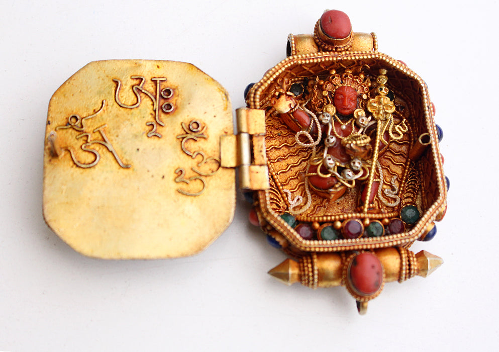 Goldplated Vajrapani Ghau Pendant with Lapis Stone - nepacrafts