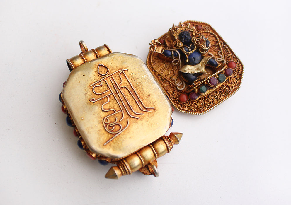 Goldplated Vajrapani Ghau Pendant with Lapis Stone - nepacrafts